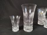 three glass vases sitting next to each other on a table