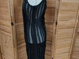 an image of a mannequin dressed in a black dress