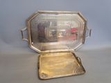 a silver tray with a mirror in it on a table