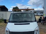 a white van that is parked in the dirt