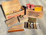 many different types of cigarettes in wooden boxes on the ground