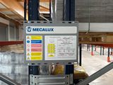 a picture of a sign in a warehouse that says megaluxx
