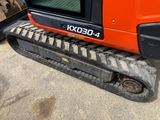 a close up view of a small excavator on the ground
