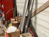 a pile of junk in a garage next to a building
