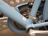 a close up of a bicycle with a chain attached to it
