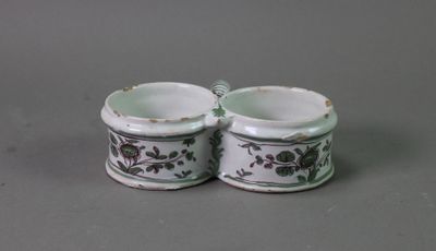 two cups that are sitting next to each other on a table