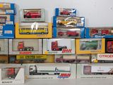 many different types of toy trucks in the box