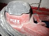 a close up of a red and white fire hydrant and hose