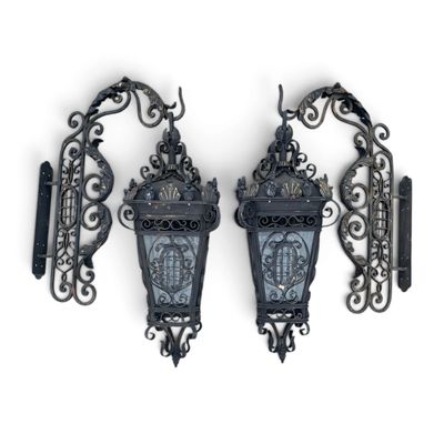 pair of antique cast iron wall sconces with glass panels