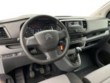 the interior of a car with a steering wheel and dashboard controls