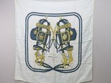 a white and blue scarf hanging on a wall with a picture of a pair of boxing gloves