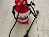 a red and white fire extinguisor sitting on the floor