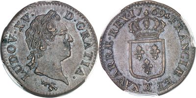 gros plan d'une pièce de monnaie surmontée d'une couronne
