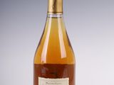 an image of a bottle of wine sitting on top of a table