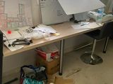 a desk with a computer monitor and a laptop on it