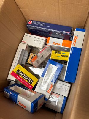 a cardboard box full of different types of electronic equipment