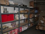 many shelves with cans of food on them in a warehouse