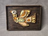 a picture of a bird that is made of wood