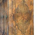 a large wooden cabinet with a decorative design on it