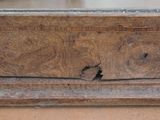 a close up of a piece of wood with a hole in it