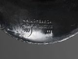an image of a close up of a metal object on a table