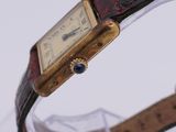 a close up of a wrist watch with a leather band