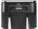 a black air fryer sitting on top of a white counter