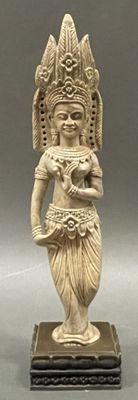 an image of a statue of a woman holding a bowl