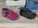 several pairs of children ' s shoes sitting on top of a table