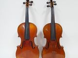 une paire de pièces de violon anciennes sur fond blanc