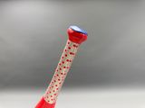 a red and white toothbrush with a blue cap on it
