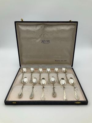 a set of six silverplated spoons and spoons in a case