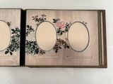 a picture of a book with a picture of flowers on it