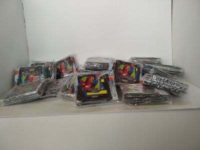 many bags of candy sitting on a shelf