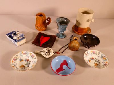 many different bowls and cups on the table