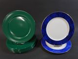 two plates with blue and green rims are sitting on a table