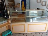 a glass display case in the middle of a room