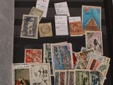 a picture of a collection of stamps on display in a glass case