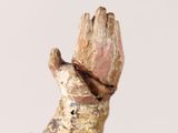 a statue of a hand with a glove on it
