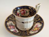 an image of a cup and saucer with a spoon on a saucer