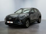 a grey toyota rav parked in a room with a white wall