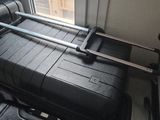 a black suitcase sitting on top of a table next to a window