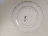 a white plate with a black design on it