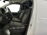 the interior of a white truck with black seats is shown