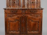 an old wooden cabinet with carvings and carvings on the doors