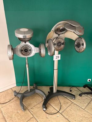 two hair dryers that are sitting on the floor