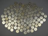 a lot of coins arranged in the shape of a heart