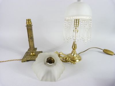 a lamp that is sitting on a table next to a lamp