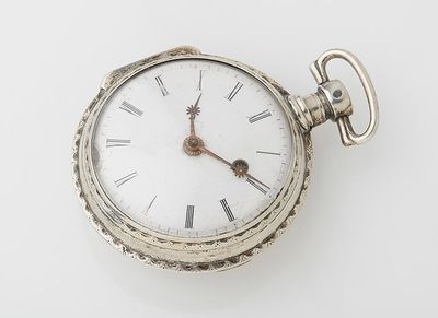 a silver pocket watch with roman numerals on the face