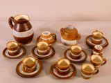 many cups and saucers that are sitting on a table